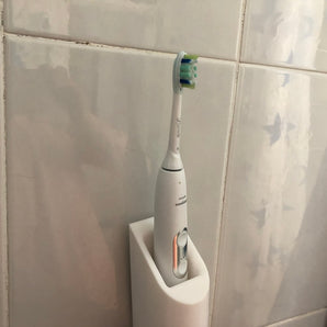 Seinään asennettava Philips Sonicare -hammasharjateline laturilla