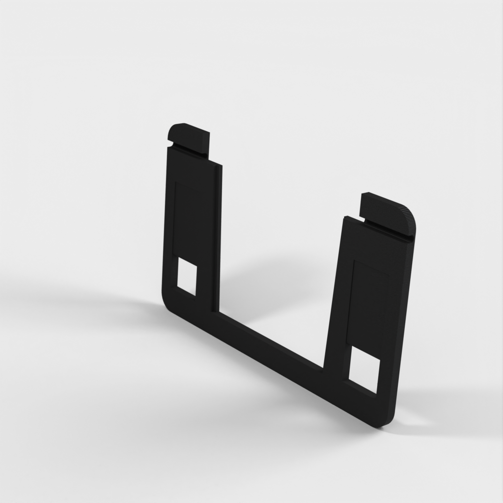 Kelluva tabletin seinäteline, jossa lataustuki