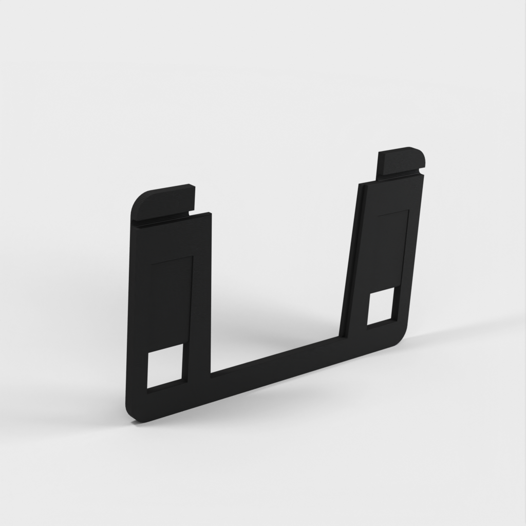 Kelluva tabletin seinäteline, jossa lataustuki