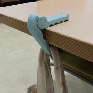 Kannettava krokotiilipöytäkoukku laukuille