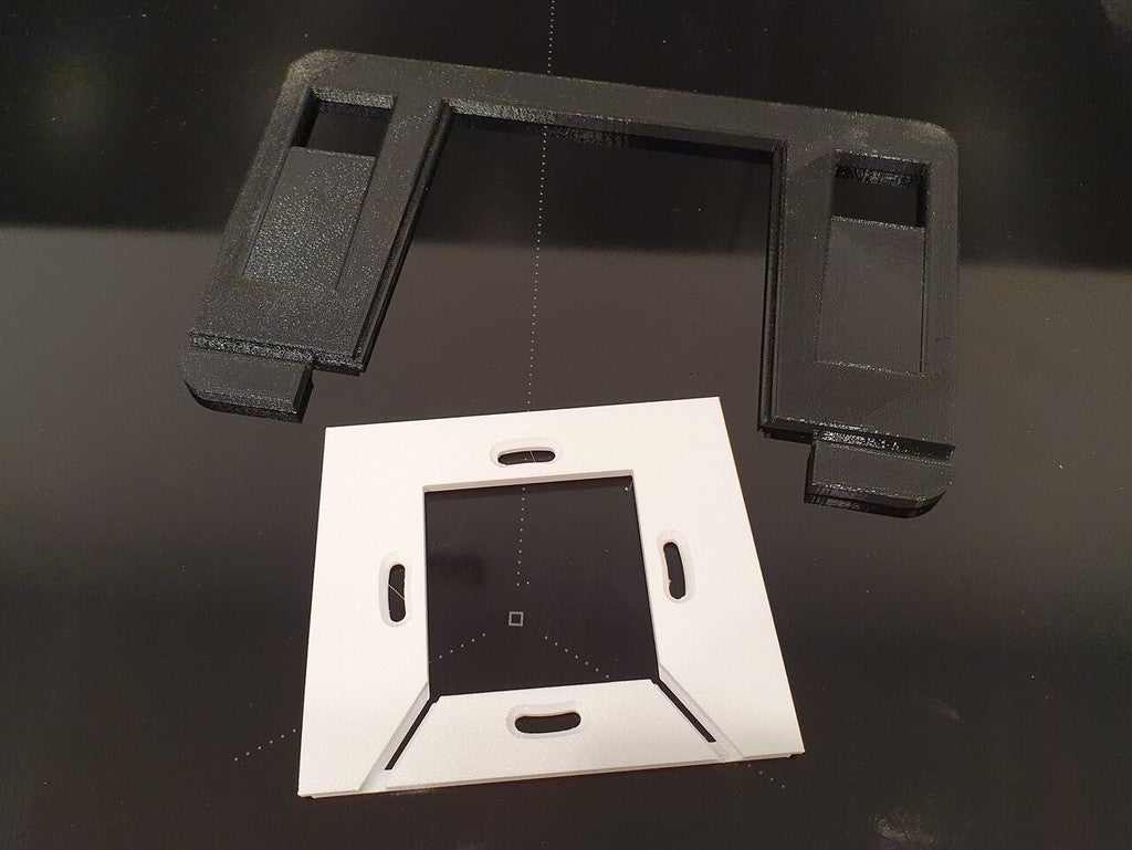 Kelluva tabletin seinäteline, jossa lataustuki