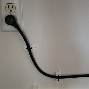 Komennonauha Zip-Tie -pidike virtajohdolle
