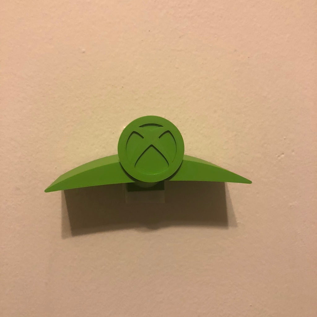 Xbox-pelikuulokkeiden seinäkiinnitys
