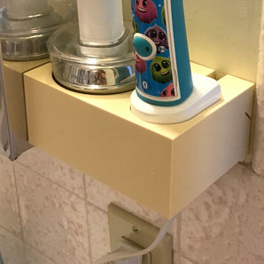 Sonicare-seinään asennettava latauskotelo hammasharjoille