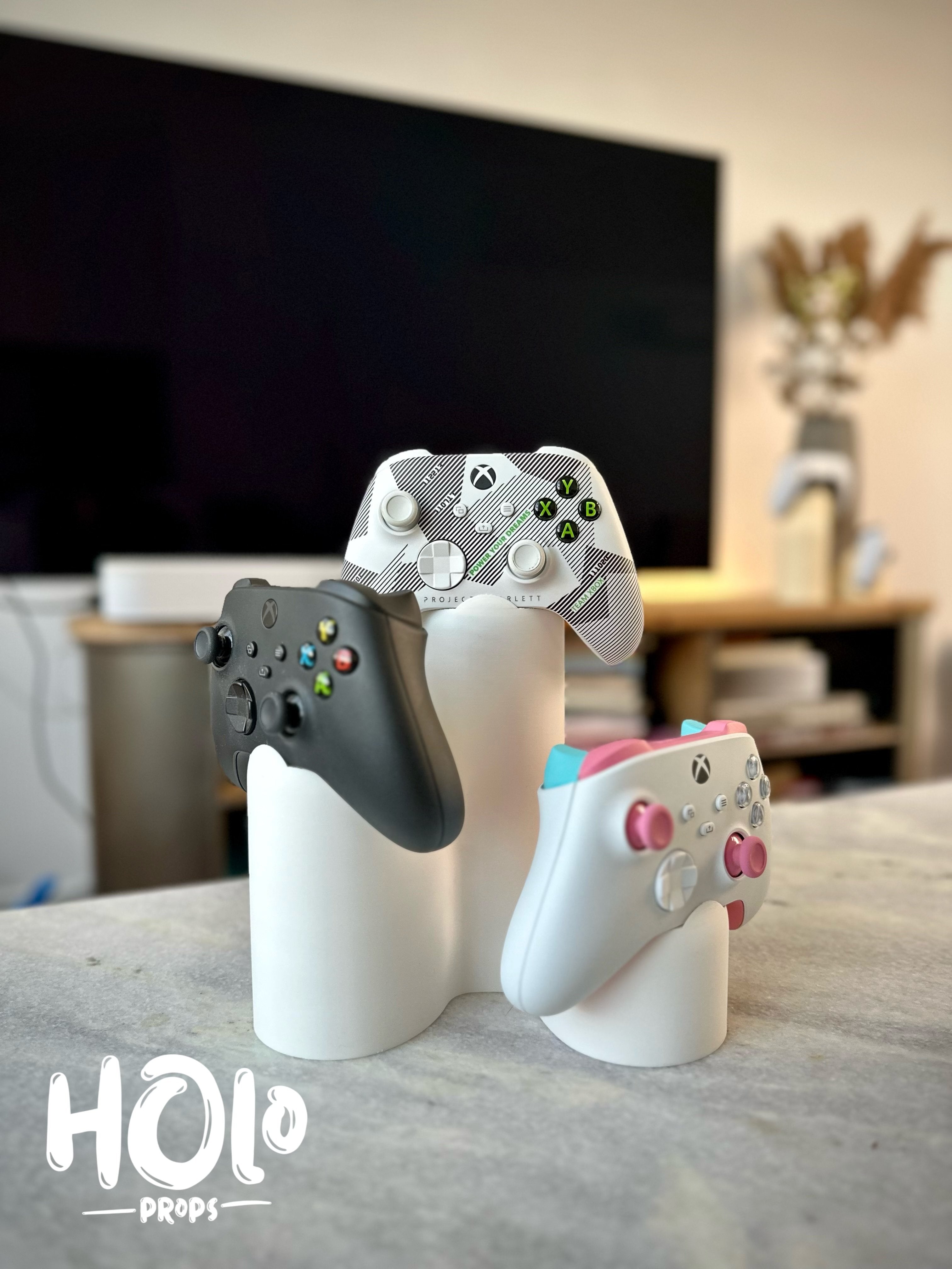 Moderni kolmen PlayStation Xbox -ohjaimen teline