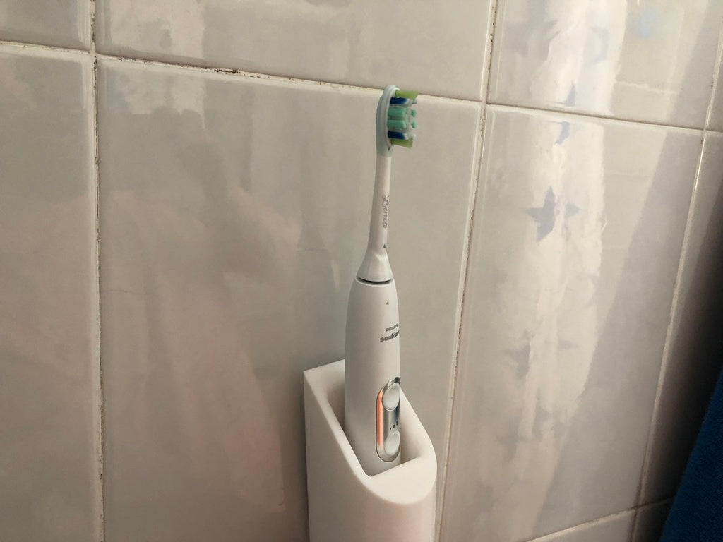 Seinään asennettava Philips Sonicare -hammasharjateline laturilla