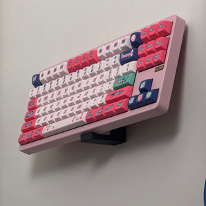 Seinään asennettava pidike näppäimistöille ja toimistotarvikkeille