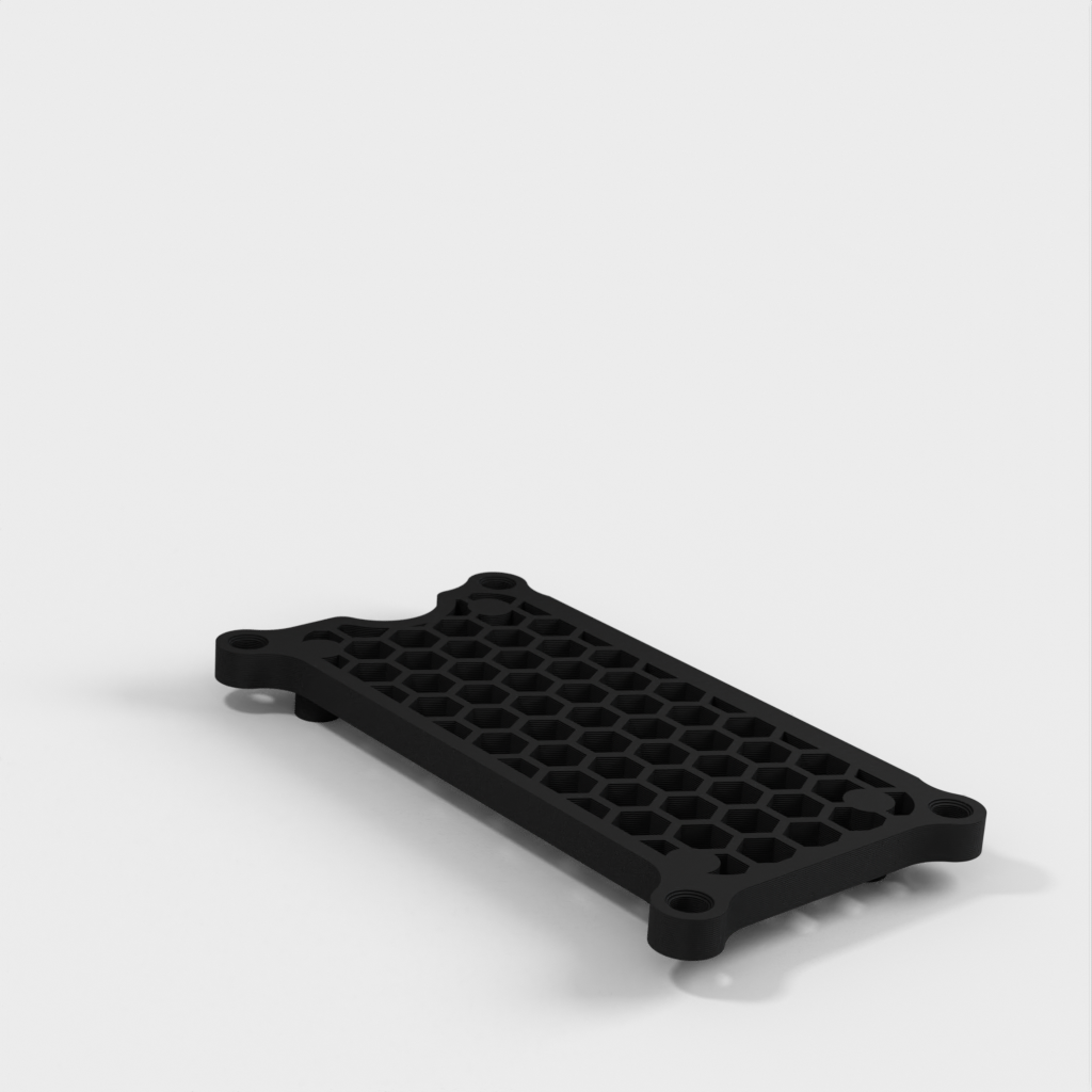 Honeycomb-kotelo Raspberry Pi Zero 2 W:lle, jossa on valinnainen ekstruusiokiinnike