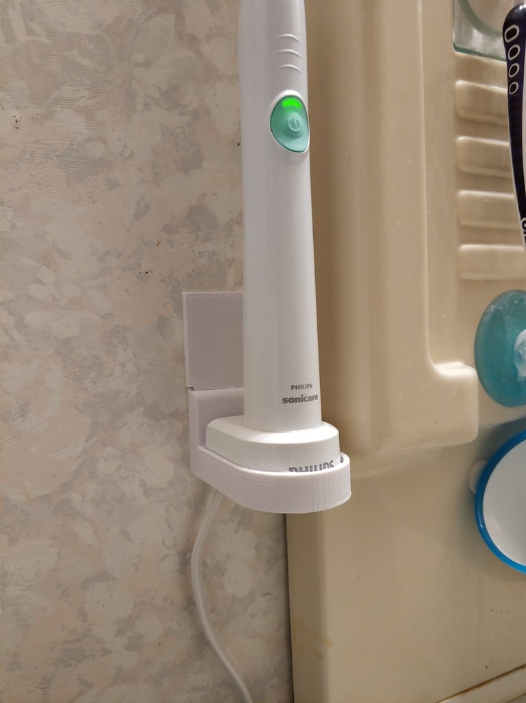 Kiinnitettävä seinäkiinnike Philips Sonicare -laturille