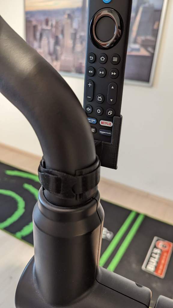 Fire TV Stick -kaukosäätimen pidike kuntopyörään turvahihnalla