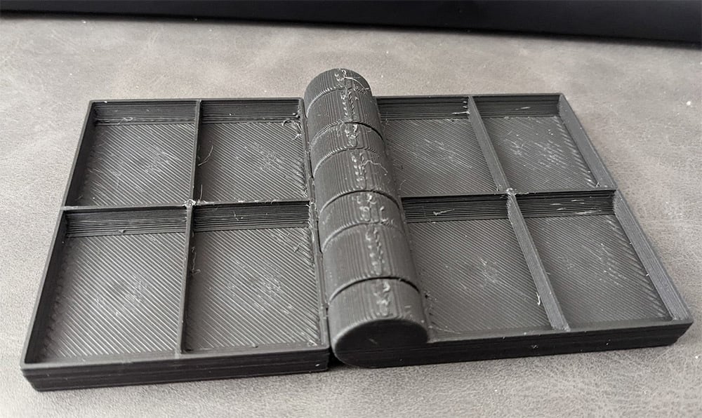 Parametrinen magneettinen kokoontaitettava osalokero