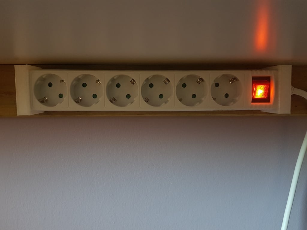Monisuuntainen kaapelinpidike virtakaapeleille