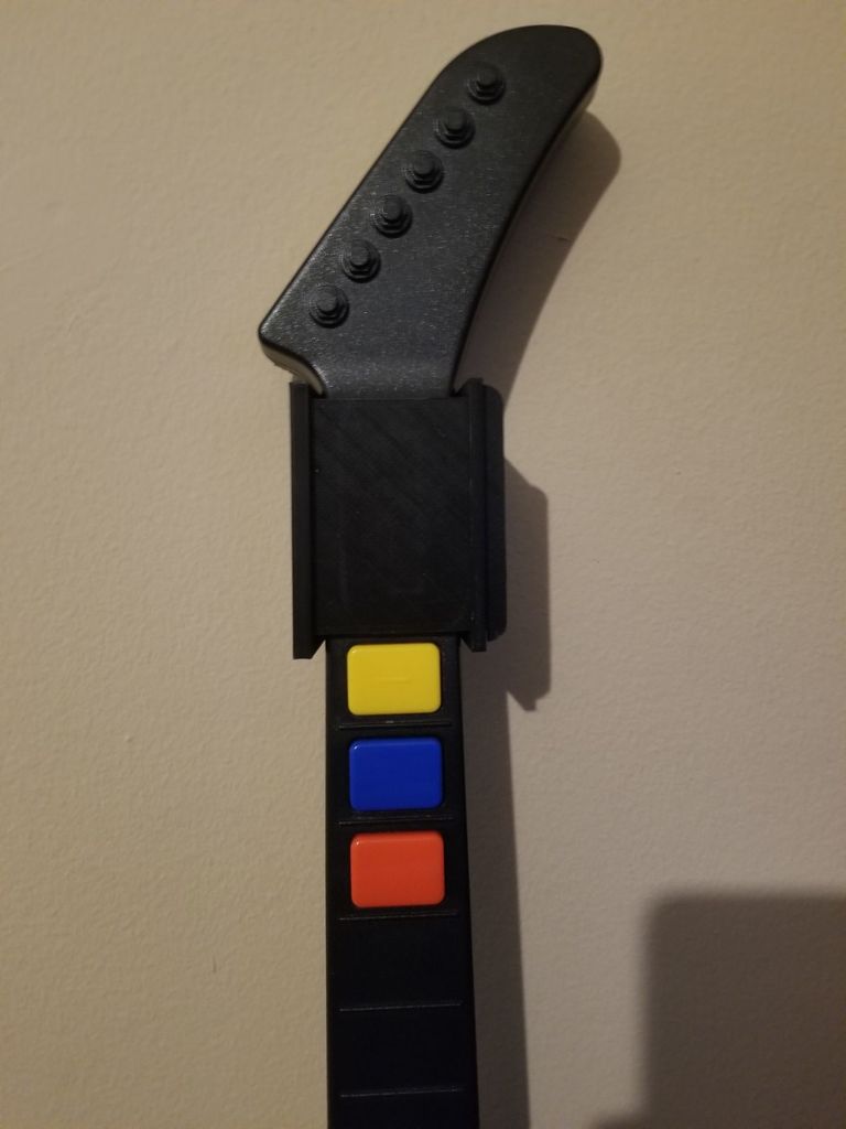 Seinäripustin Guitar Hero Xplorer V2:lle