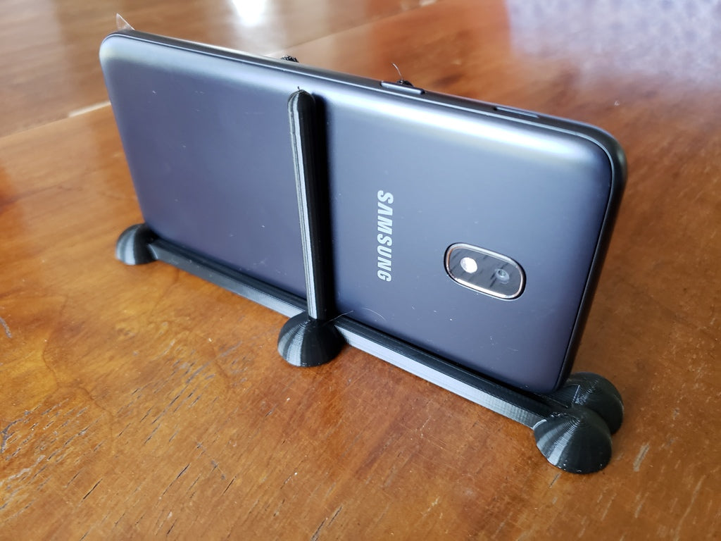 Minimalistinen puhelinjalusta Samsung J3 Orbit -puhelimelle, jossa on pallomaiset jalat