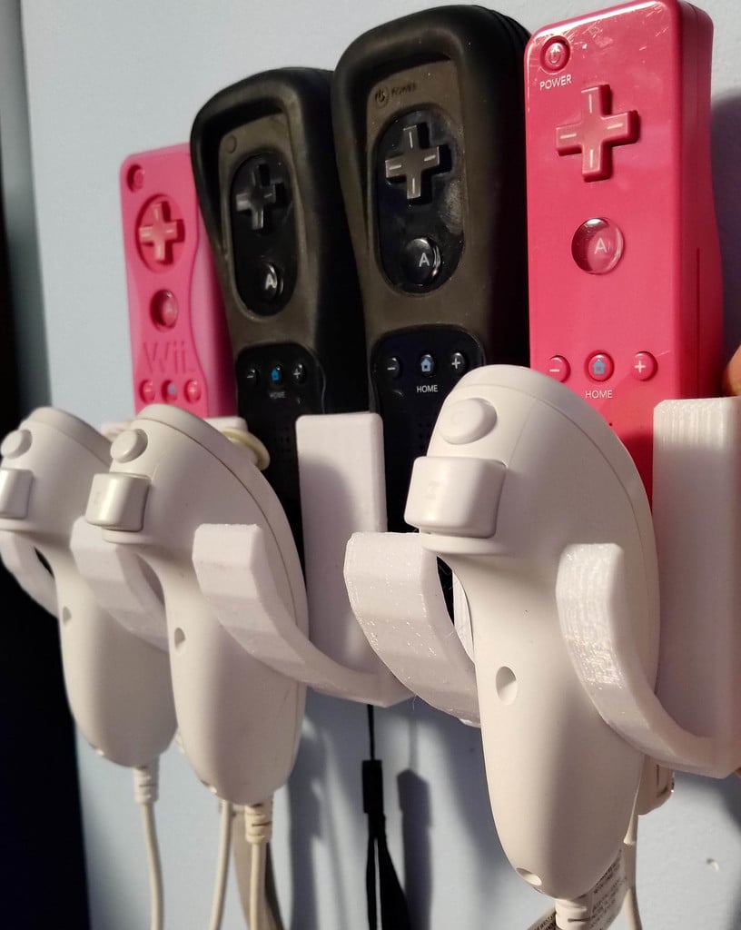 Seinäkiinnitysteline Wii-kaukosäätimelle ja Nunchuckille