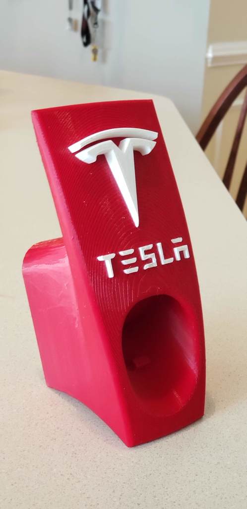 Teslan mobiililaturi ja kaapelipidike logolla ja kirjaimilla (US-versio)