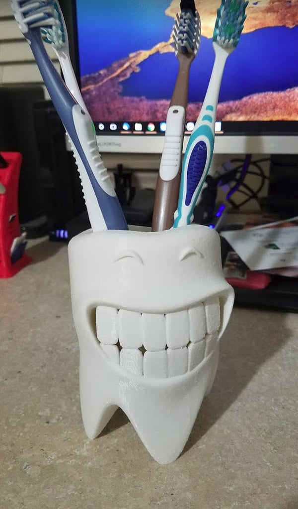 Hymyilevä hammasharjapidike tyhjennysjärjestelmällä