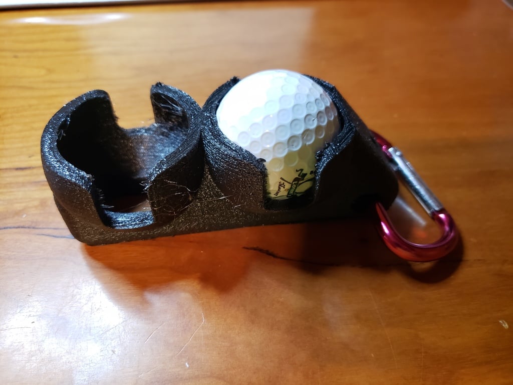 Golfpallon pidike T-pidikkeillä vyön kiinnitystä varten