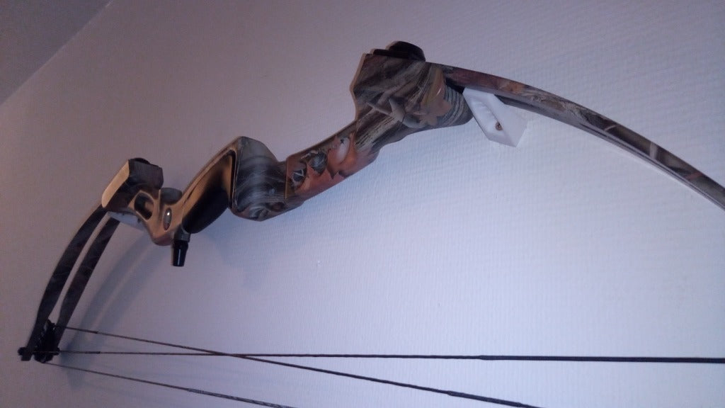 Yleiskäyttöinen seinäkiinnike Recurve- tai Compound-jousille ja Snapback Cap Edge