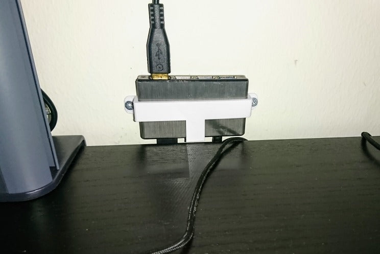 Seinäteline Icybox IB-AC610 4-porttiselle USB-keskittimelle