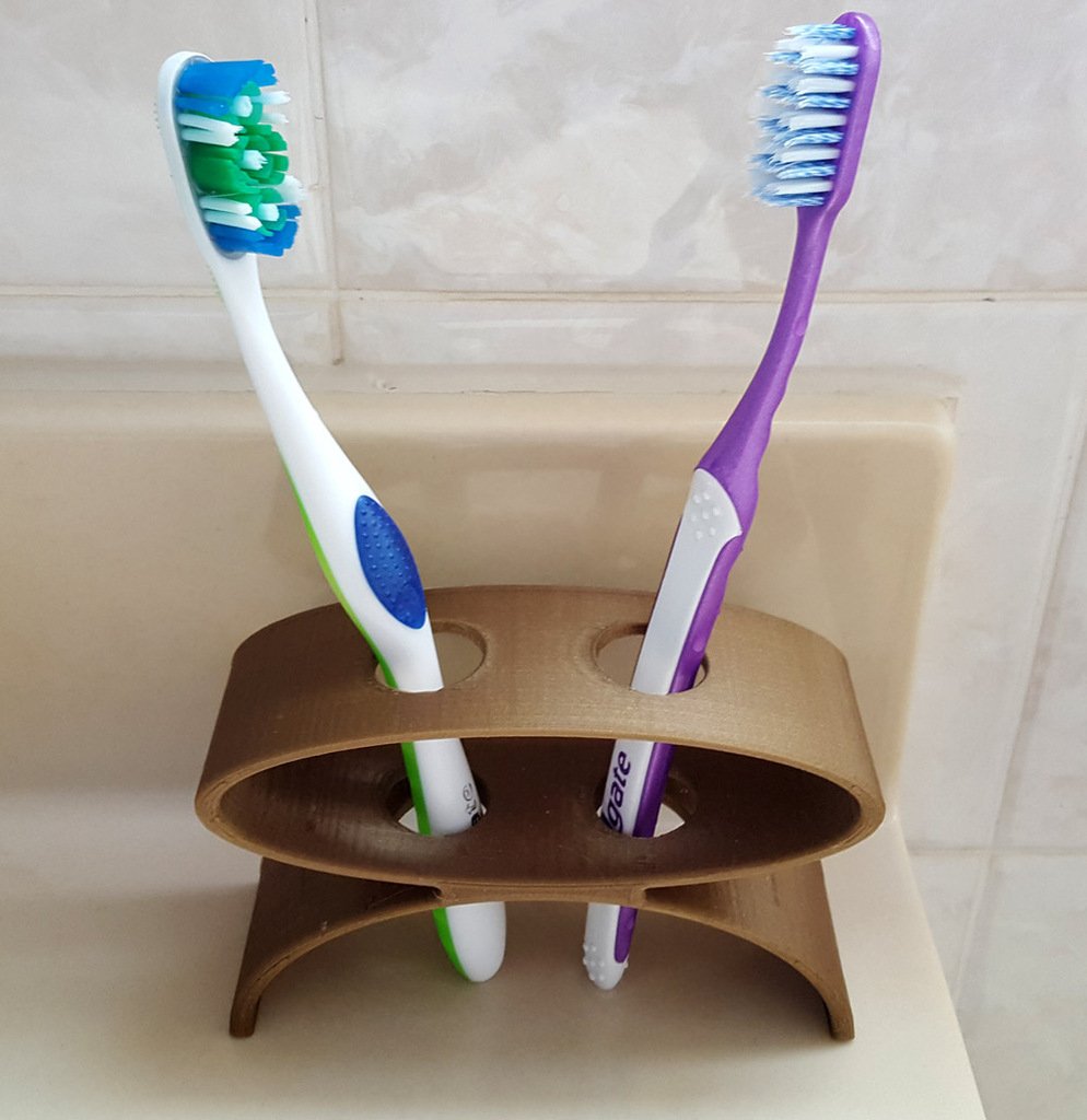 Kaksinkertainen hammasharjan pidike