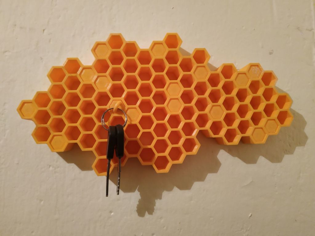 Hunajakennomainen avainten järjestäjä seinäasennusta varten