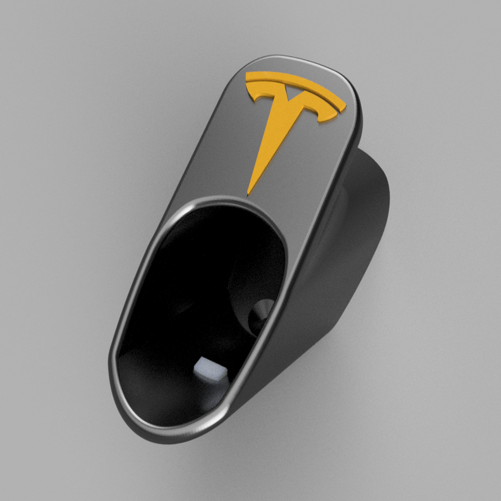 Tesla Charger Organizer erillisellä logosisäkkeellä ja nupilla