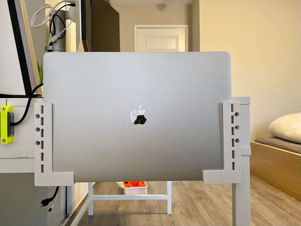 Seinäteline MacBook Prolle